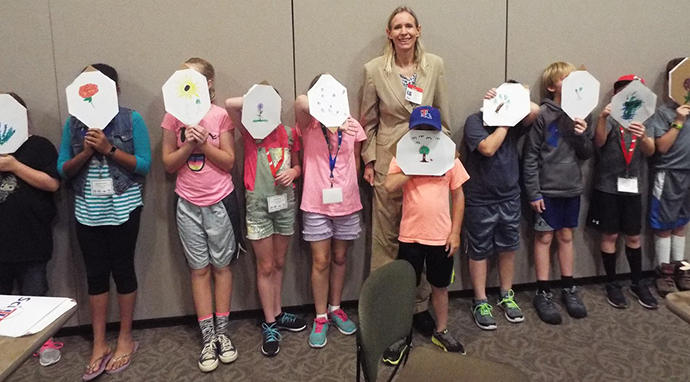 Third -Fifth Graders Holding up Lignin Shields for Biomass